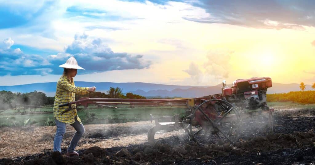 A farmer using modern machinery in the field.